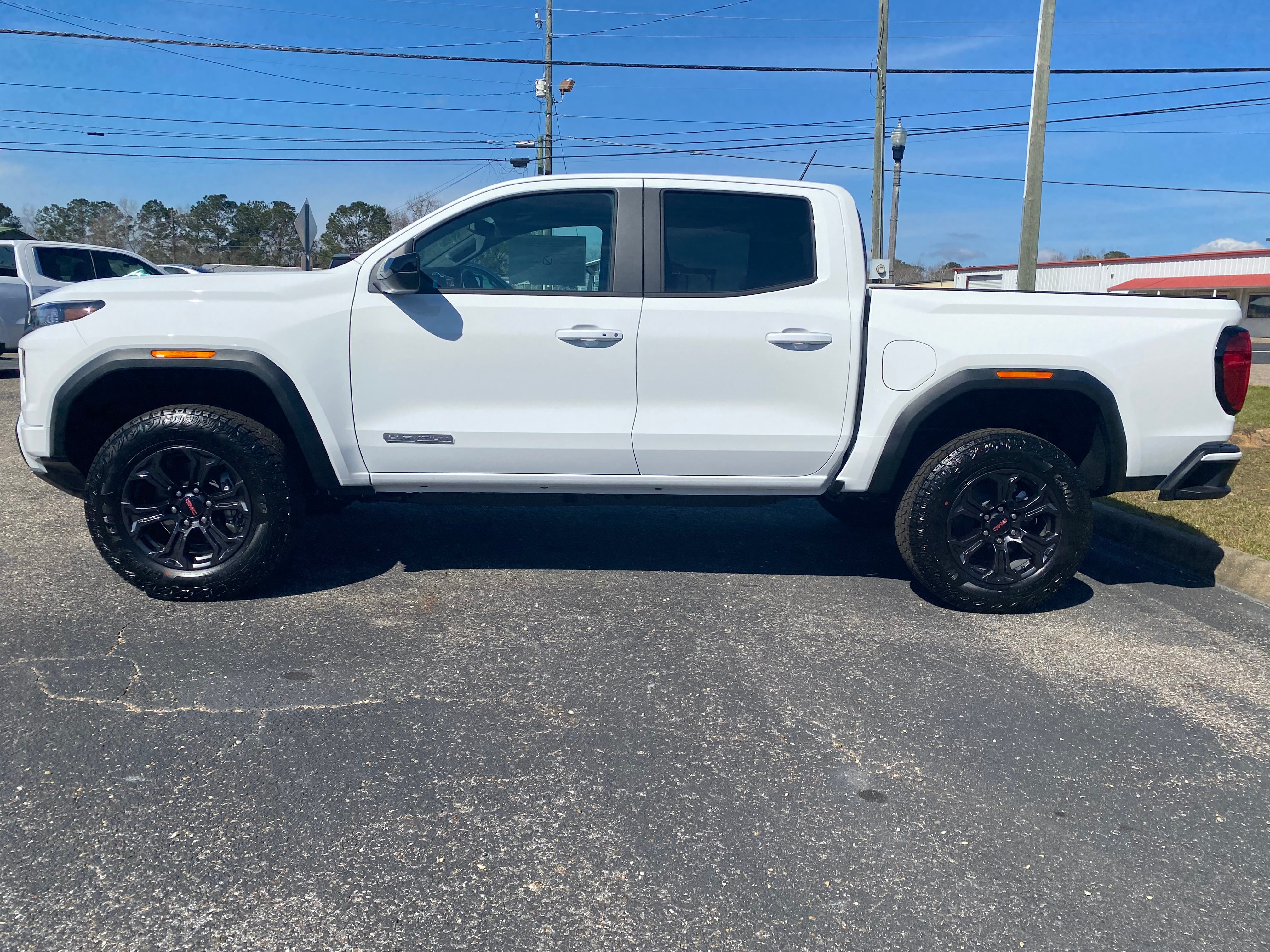 2025 GMC Canyon Elevation in Summit White — front three-quarter view